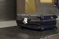 Suitcases on a luggage band on the airport Royalty Free Stock Photo