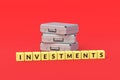 Suitcases near cubes with word investments. Investing in stocks, bonds and securities