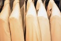 Suits on a clothing hanger. Merchandizing of clothes in a boutique. Royalty Free Stock Photo