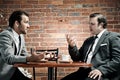 Suits, coffee and conversation Royalty Free Stock Photo