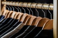 Suits for men hanging on the rack. Mens suits in different colors hanging on hanger in a retail clothes store, close-up Royalty Free Stock Photo