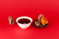 Sujeonggwa - Korean cold fruit tea or chilled punch red background with copy space. It is made from dried or fresh persimmons