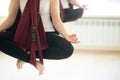 Sukhasana yoga pose in hammocks