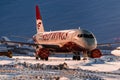 Sukhoi Superjet 100 Red Wings Airlines parked at the airport at night