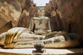 White Buddha statue in Wat Sri Chum temple in Sukhothai Historical park in Sukhothai, Thailand.