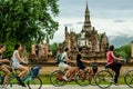 SUKHOTHAI, THAILAND Ã¢â¬â JULY 25, 2019: Tourist cycling around Ancient-remains that show the evolution from past-time in Sukhothai