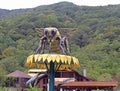 A huge sculpture of bee on flower