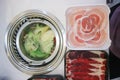 Sukiyaki ,suki or shabu pot and sliced beef Royalty Free Stock Photo