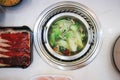 Sukiyaki ,suki or shabu pot and sliced beef Royalty Free Stock Photo