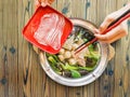 Sukiyaki cooking on wooden table background