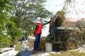 Farmers are grinding rice with a mobile rice milling machine. Royalty Free Stock Photo