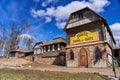 Sula, Belarus - April 04, 2021 - Ethnographic village museum where guided tours. Inscription in Russian Museum of Bread and Cheese