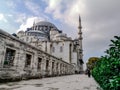 Suleymaniye Mosque in Istanbul Turkey on a cloudy summer-autumn day, close-up. White stone walls of an ancient muslim temple in Royalty Free Stock Photo