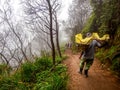 Sulfur Miner Carrying Baskets Loaded with Sulfur at Kawah Ijen Volcano