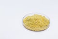 Sulfur powder in petri dish, chemical substance for industrial use