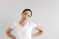 Sulk and grumpy face expression of woman in white t-shirt. Concept of offended peevish and sulky Royalty Free Stock Photo