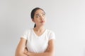 Sulk and grumpy face expression of woman in white t-shirt. Concept of offended peevish and sulky Royalty Free Stock Photo