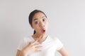 Sulk and grumpy face expression of woman in white t-shirt. Concept of offended peevish and sulky Royalty Free Stock Photo