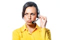 Sullen call centre operator listening to a call Royalty Free Stock Photo