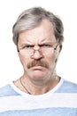 Sullen caucasian mature man in glasses isolated