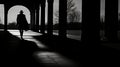 sullen man in the distance walking along a deserted suburban road Royalty Free Stock Photo