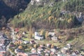 Sulov village in Sulovske skaly mountainy with houses, church, road and forest with rocks above in Slovakia Royalty Free Stock Photo