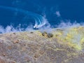 Sulphur gas coming out of the edge of the volcanic crater on the Vulcano island in the Aeolian islands, Sicily, Italy Royalty Free Stock Photo