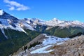 Sulphur skyline trail. Beautiful high mountains covered with snow, green forrest, white clouds, blue sky. Royalty Free Stock Photo