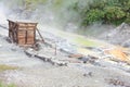 Sulphurous mountain valley with hot spring stream and steam at Tamagawa Onsen Hot spring in Senboku city, Akita prefecture, Japan