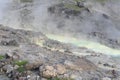 Sulphurous mountain valley with hot spring stream and steam at Tamagawa Onsen Hot spring in Senboku city, Akita prefecture, Tohoku