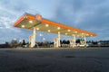 Shell gas station pumps with illuminated awning and sign