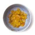 Sultanas in a small ceramic bowl