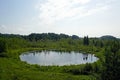 A sultry day in July. Forest by the lake. A beautiful deep lake named Devil `s Eye Royalty Free Stock Photo