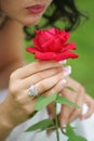 Sultry woman with single red rose