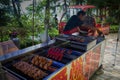 A mobile vendor of grilled meat.