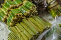 Suman or budbud, a rice cake wrapped in banana leaves, for sale in a public market Royalty Free Stock Photo