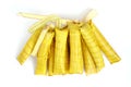 Suman sa Ibos, a traditional sticky rice cake wrapped in buli leaves on white background
