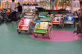 beautiful colorful mini pedicabs at the Jatinangor National Flower Park tourist attraction in the afternoon