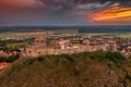 Sumeg, Hungary - Aerial panoramic view of the famous High Castle of Sumeg in Veszprem county at sunset with storm clouds Royalty Free Stock Photo