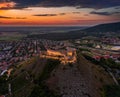 Sumeg, Hungary - Aerial view of the famous illuminated High Castle of Sumeg in Veszprem county at sunset with colorful clouds Royalty Free Stock Photo