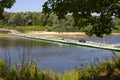 Sumerlya, Russia - July 17, 2021: Pontoon bridge over the Sura river. Floating metal bridge car traffic across the river