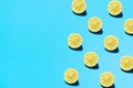 Summer abstract trendy fresh concept. Lemon pattern on bright light blue background, copy space. Royalty Free Stock Photo