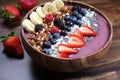 Summer Acai smoothie bowl with various fruits and berries. Healthy breakfast