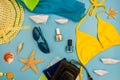 Summer accessories and items for travel on a blue background Royalty Free Stock Photo