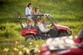 Summer activities for adults - friends make selfies on quad bikes Royalty Free Stock Photo