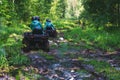 Summer Activities for adults - a trip on quad bikes on the dirty road. Royalty Free Stock Photo