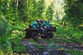Summer Activities for adults - a trip on quad bikes on the dirty road. Royalty Free Stock Photo