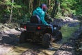 Summer Activities for adults - a trip on quad bikes on the dirty road. Royalty Free Stock Photo