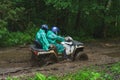 Summer Activities for adults - a trip on quad bikes on the dirty road. Royalty Free Stock Photo