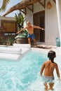 Summer Activity. Pool Entertainment With Kid On Vacation At Tropical Resort. Father Going To Jump In Water Mattress.